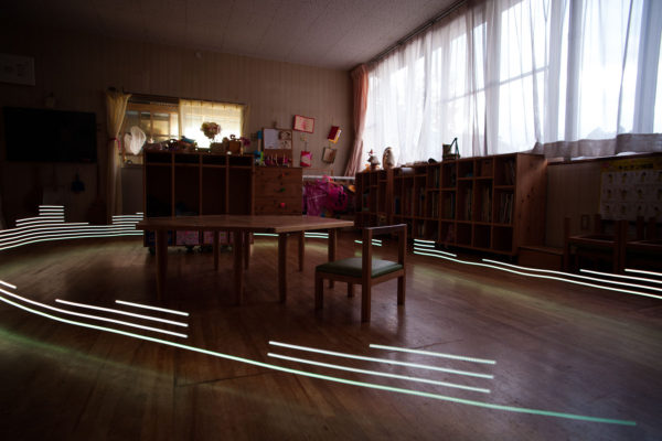 A special light painting tool reveals radioactive contamination. Here at the nursery school Soramame in Fukushima city the levels are very low, but this has not stopped the business profoundly suffering in the wake of the 2011 Fukushima nuclear meltdowns. Greenpeace/Greg McNevin