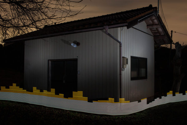 Radioactive contamination around a storage shed is revealed at the Sugano house in Ryozen, Date, using a special light painting tool. Surrounded by orchards and forest, the Sugano's property was decontaminated by officials, but it is continually re-contaminated by the surrounding land which was not comprehensively cleaned. Here we see radiation levels between 0.24uSv/h and 0.34 uSv, with yellow showing spots elevated above the government decontamination target of 0.23 uSv/h. Greenpeace/Greg McNevin