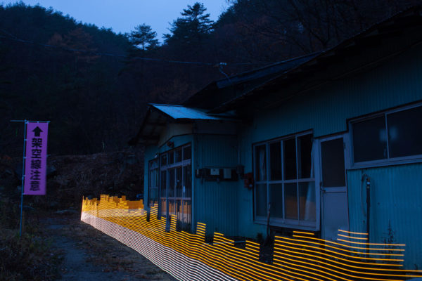 A special light painting technique reveals radioactive contamination at Toru Anzai's former home in Iitate. Surrounded by forest, the property remains contaminated despite being cleaned up. Five years on Mr Anzai is tryign to move on with his life, and as he does not wish to return to his contaminated home, it is now falling into disrepair. Here we see radiation levels between 0.61uSv/h and 1.11uSv/h, with yellow showing spots elevated above the government decontamination target of 0.23 uSv/h, and red above 1uSv/h. Greenpeace/Greg McNevin