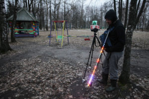 This behind the scenes image shows Greg McNevin testing lightpainting equipment to be used to highlight contamination in the town of Zlynka, Russia. Greenpeace/Evgeny Usov